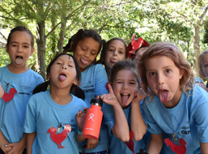 Children sticking out their tongue during zoo camps