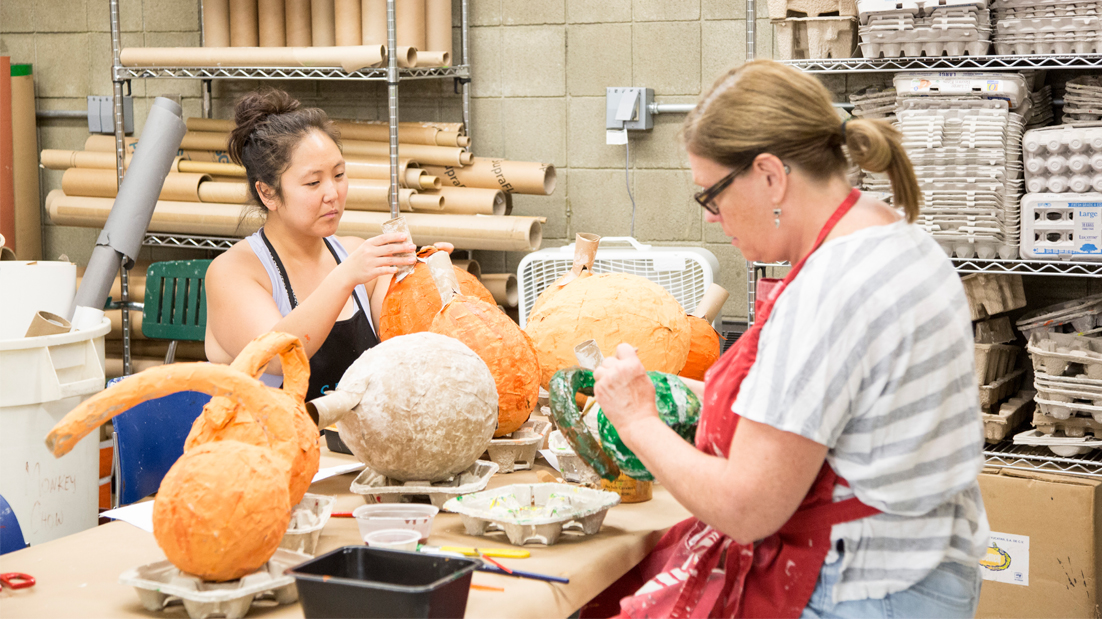 Volunteers and staff make enrichment pinatas for the animals