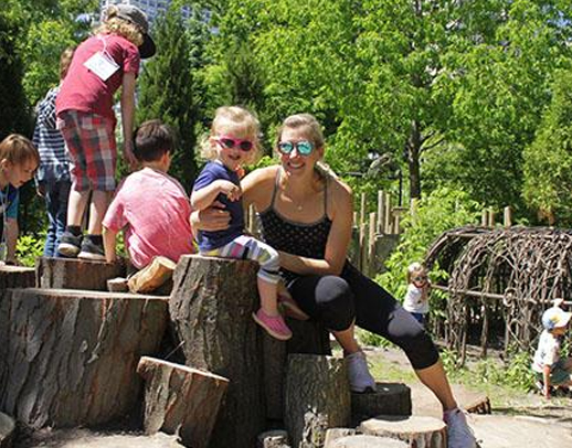 Childrenn playing on tree stumps