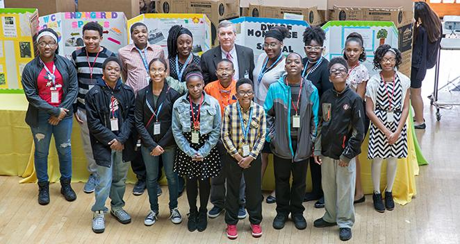 Lincoln Park Zoo President and CEO Kevin Bell joins Young Researchers Collaborative participants at the 13th annual Science Celebration. Above: A YRC student team presents its animal-behavioral study results.