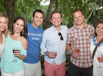 Six adults posing for a photo at Summer Wine Fest