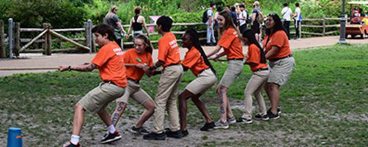 Youth play tug of war on the South Lawn