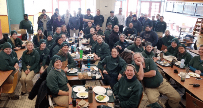 Animal Care staff taking a lunch break after a long day working in the cold