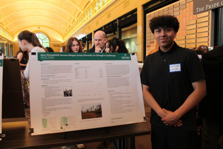 Partners in Fieldwork participant showing poster